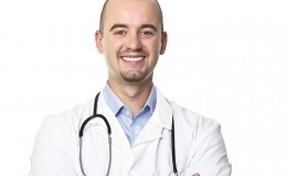 smiling doctor isolated on white