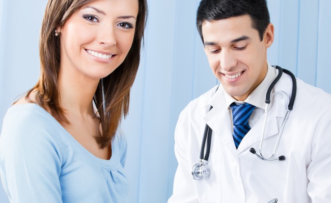 Smiling patient and doctor at office